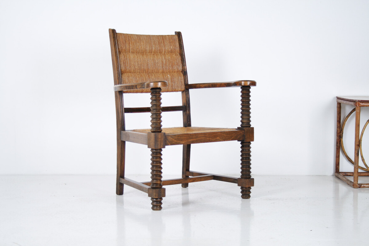A 1950s Oak Corkscrew Armchair with Straw Seat attributed to Charles Dudouyt